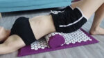 acupressure mat and pillow in use